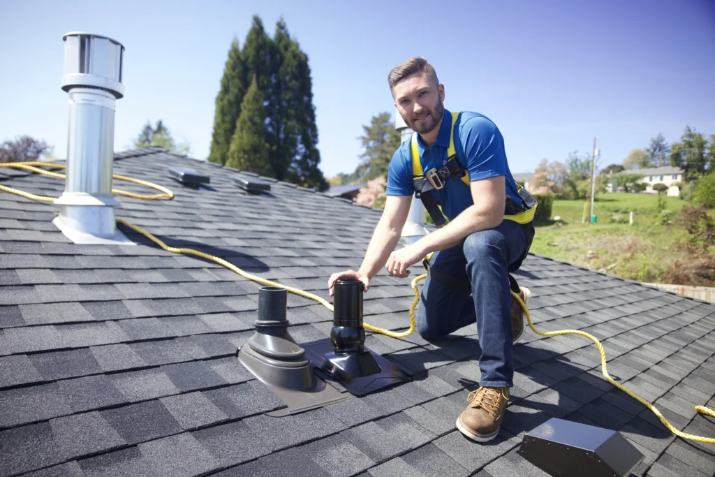 Man replacing a piece of a roof.